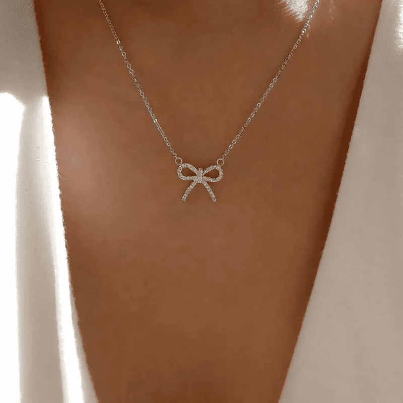 Stylish Silver Bow Pendant Necklace Perfect Gift for Women Elegant and Timeless Jewellery for Special Occasions.